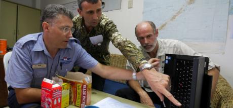 Discussing plans in the aftermath of Typhoon Haiyan in the Philippines, 2013