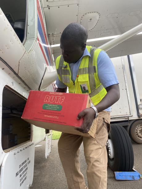 Loading RUTF into the aircraft