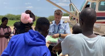 Refugees boarding the flight in Renk, South Sudan
